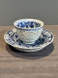 A Chinese blue and white reticulated double-walled cup and saucer, lingzhi mark, Kangxi