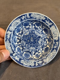 A Chinese blue and white reticulated double-walled cup and saucer, lingzhi mark, Kangxi
