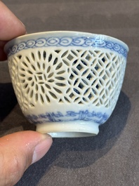 A Chinese blue and white reticulated double-walled cup and saucer, lingzhi mark, Kangxi