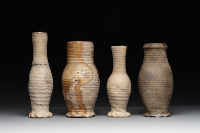 A collection of 8 German proto stoneware ribbed jugs, including 'Jacobakans', 14th C.