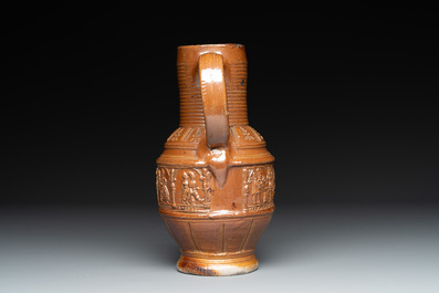 A Raeren stoneware 'peasant dance' jug, late 16th C.