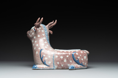A pair of Chinese blue, white and copper-red stag-shaped jardini&egrave;res, 19th C.