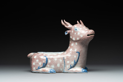 A pair of Chinese blue, white and copper-red stag-shaped jardini&egrave;res, 19th C.