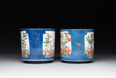 A pair of Chinese powder blue-ground famille verte vessels with a bird in a garden, Kangxi