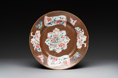 A Chinese famille rose dish, a teapot, a milk jug and a cup, Yongzheng/Qianlong
