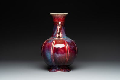 A Chinese flamb&eacute;-glazed vase with archaistic dragon handles, 19th C.