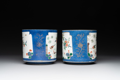 A pair of Chinese powder blue-ground famille verte vessels with a bird in a garden, Kangxi