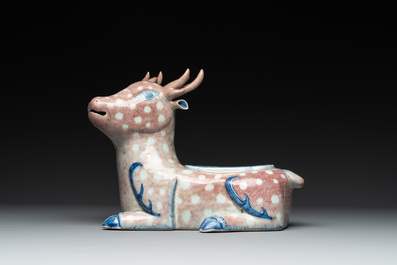 A pair of Chinese blue, white and copper-red stag-shaped jardini&egrave;res, 19th C.