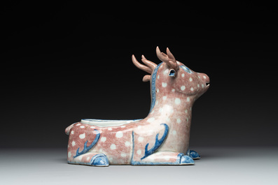 A pair of Chinese blue, white and copper-red stag-shaped jardini&egrave;res, 19th C.