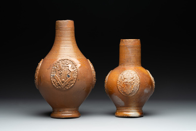 Two armorial stoneware jugs, Raeren, one dated 1586, 16/17th C.