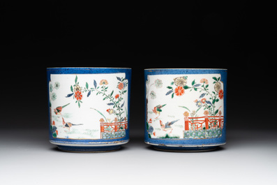 A pair of Chinese powder blue-ground famille verte vessels with a bird in a garden, Kangxi
