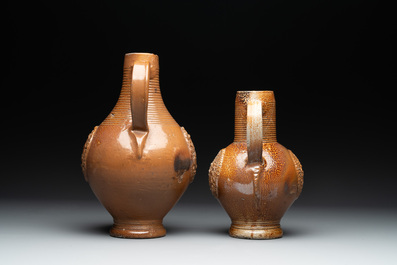Two armorial stoneware jugs, Raeren, one dated 1586, 16/17th C.