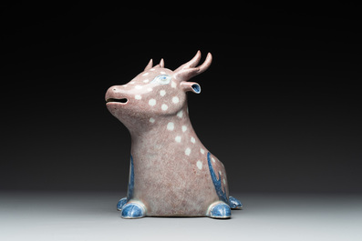 A pair of Chinese blue, white and copper-red stag-shaped jardini&egrave;res, 19th C.