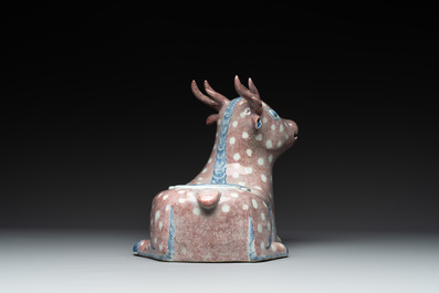 A pair of Chinese blue, white and copper-red stag-shaped jardini&egrave;res, 19th C.