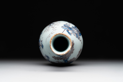 A Dutch Delft blue, white and manganese chinoiserie bottle vase, late 17th C.