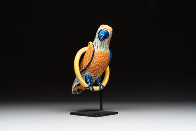 A polychrome Dutch Delft parrot on a later metal stand, 18/19th C.