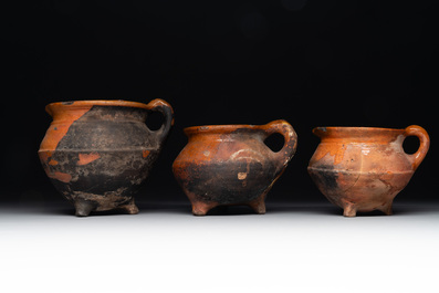 A collection of 10 parcel-glazed pottery so-called &lsquo;grapen&rsquo;, tripod cooking pots, 14th/17th C.