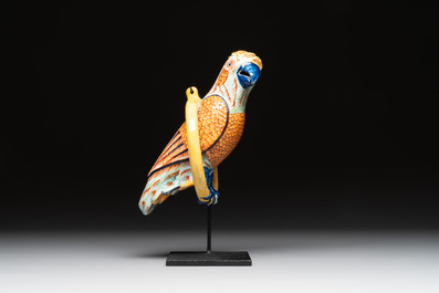 A polychrome Dutch Delft parrot on a later metal stand, 18/19th C.