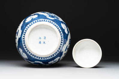 Two Chinese blue and white 'peonies' and 'peonies and antiquities' jars and covers, 19th C.