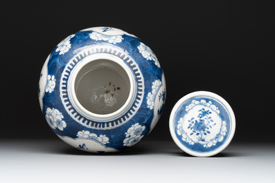 Two Chinese blue and white 'peonies' and 'peonies and antiquities' jars and covers, 19th C.