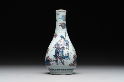 A Dutch Delft blue, white and manganese chinoiserie bottle vase, late 17th C.