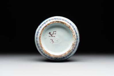 A Dutch Delft blue, white and manganese chinoiserie bottle vase, late 17th C.
