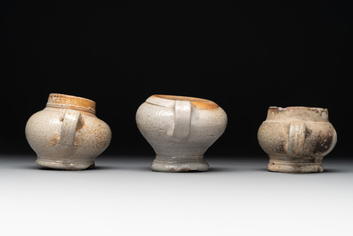 14 German stoneware jugs, mugs and vessels, 14/16th C.