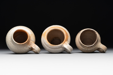 14 German stoneware jugs, mugs and vessels, 14/16th C.