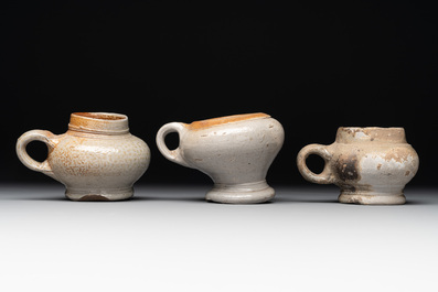 14 German stoneware jugs, mugs and vessels, 14/16th C.