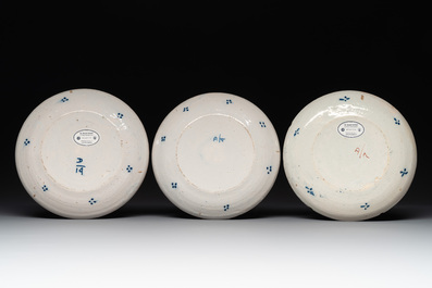 Seven Dutch Delft polychrome 'flower basket' plates, 18th C.