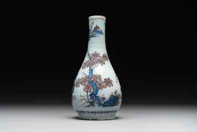 A Dutch Delft blue, white and manganese chinoiserie bottle vase, late 17th C.