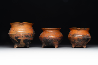 A collection of 10 parcel-glazed pottery so-called &lsquo;grapen&rsquo;, tripod cooking pots, 14th/17th C.