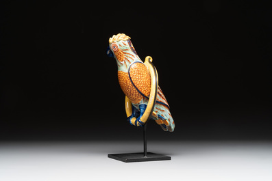 A polychrome Dutch Delft parrot on a later metal stand, 18/19th C.