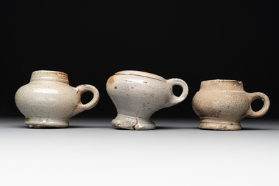 14 German stoneware jugs, mugs and vessels, 14/16th C.