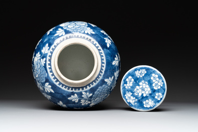 Two Chinese blue and white 'peonies' and 'peonies and antiquities' jars and covers, 19th C.