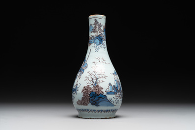 A Dutch Delft blue, white and manganese chinoiserie bottle vase, late 17th C.