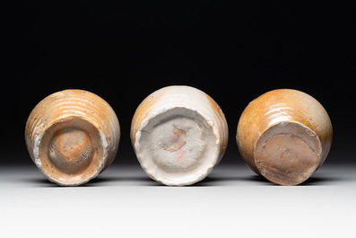 A collection of 13 German stoneware jugs, 15th C. and later