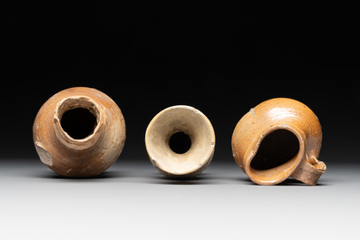 18 German stoneware jugs, mugs and vessels, 15th C. and later