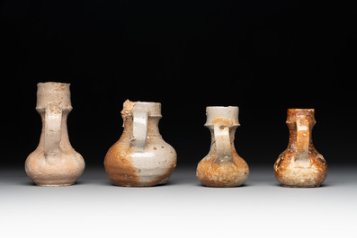 18 German stoneware jugs, mugs and vessels, 15th C. and later