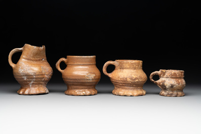 18 German stoneware jugs, mugs and vessels, 15th C. and later