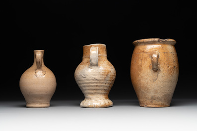 18 German stoneware jugs, mugs and vessels, 15th C. and later