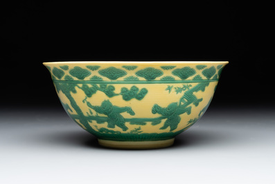 An imperial Chinese green-enamelled yellow-ground 'playing boys' bowl, Yongzheng mark and of the period