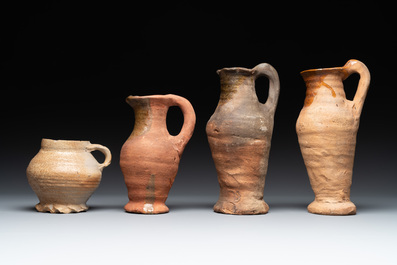 A collection of 9 German proto stoneware jugs and vessels, 14th C.