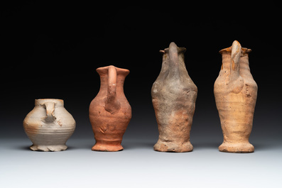 A collection of 9 German proto stoneware jugs and vessels, 14th C.