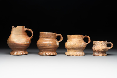 18 German stoneware jugs, mugs and vessels, 15th C. and later