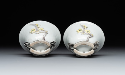 A pair of Chinese Dehua blanc de Chine relief-decorated famille rose 'prunus' cups, 19th C.