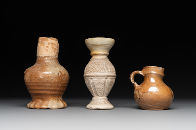 18 German stoneware jugs, mugs and vessels, 15th C. and later