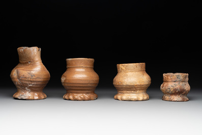 18 German stoneware jugs, mugs and vessels, 15th C. and later