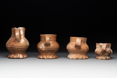 18 German stoneware jugs, mugs and vessels, 15th C. and later