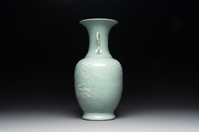A Chinese slip-decorated celadon-glazed vase with floral design, Qianlong mark and of the period